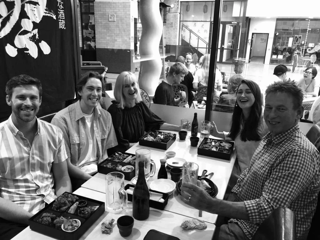 Black and white family photo at restaurant